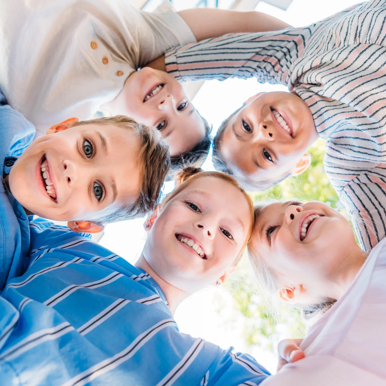 bottom-biew-of-group-of-cute-schoolchildren-standi-2026-01-06-00-25-25-utc